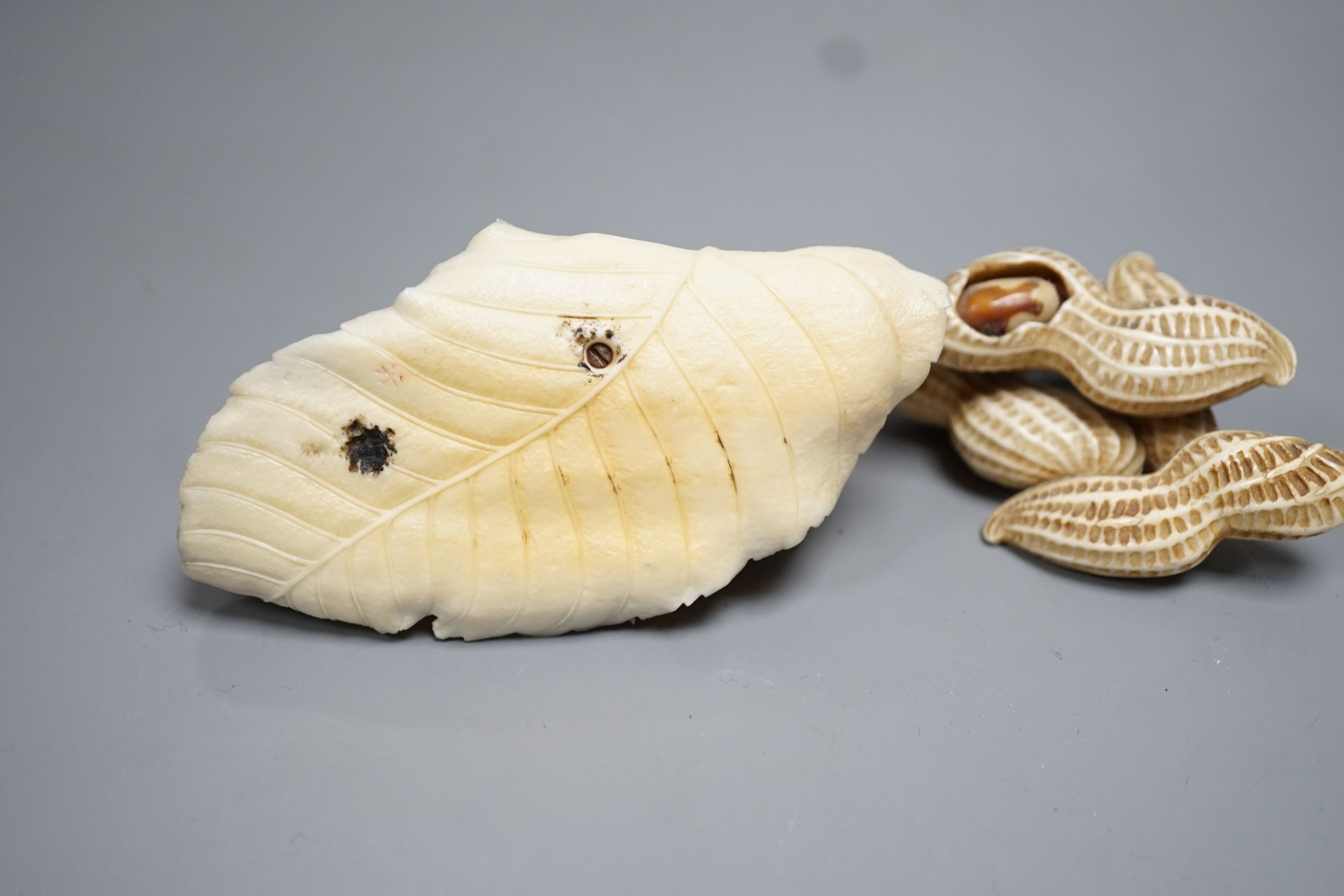 Two Japanese Ivory models of group groups of nuts, first half 20th century, largest 11cm